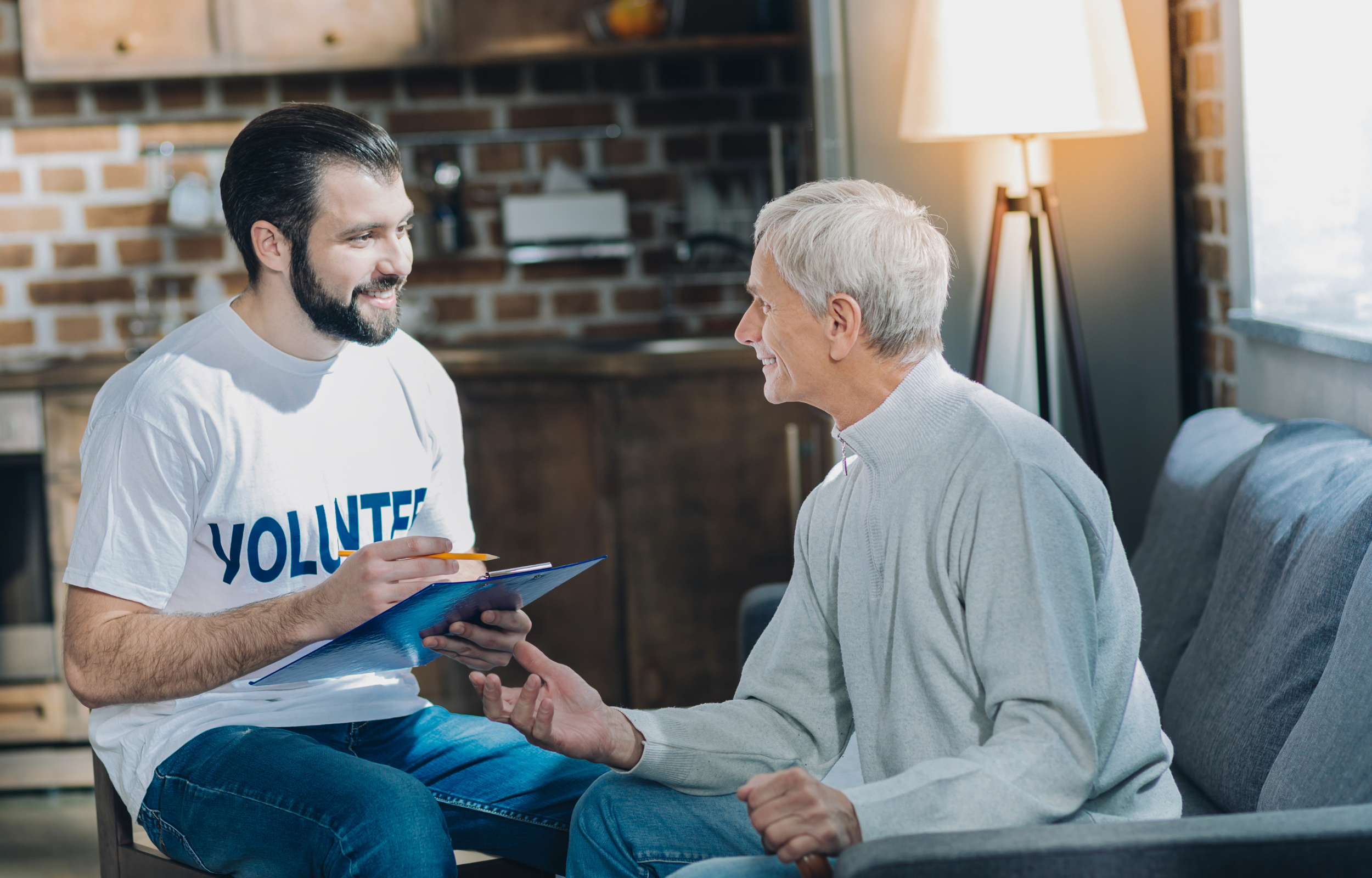 Male volunteer and older man with a form